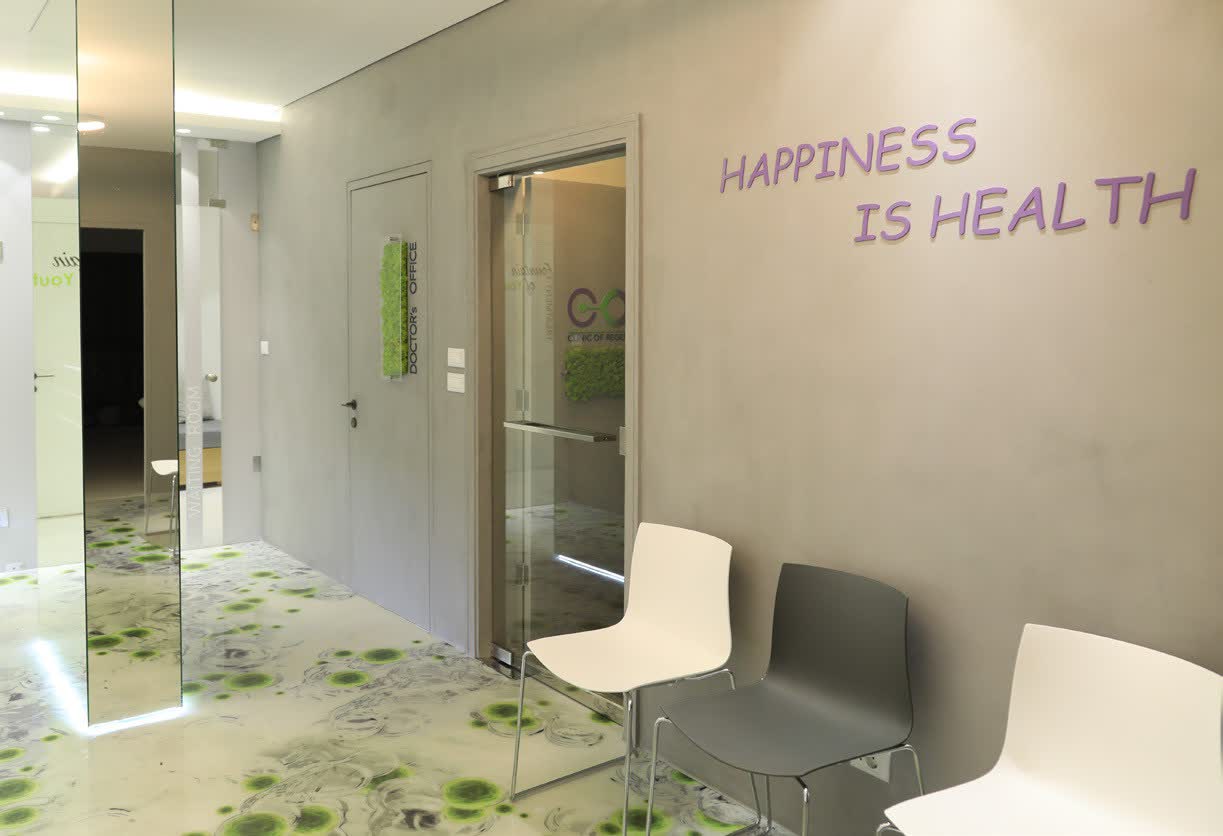 The waiting area at Cormedicine, with Happiness is health lettering on the wall